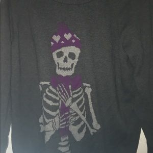 Dark grey sweater with skeleton in a hat & scarf